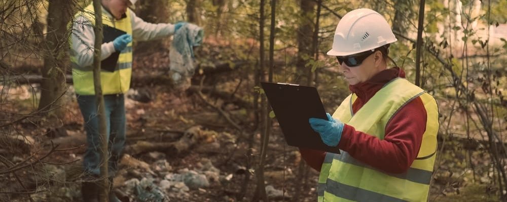 Man,And,Woman,Environmentalists,In,Workwear,And,Helmets,Document,Offense